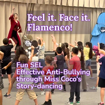 Miss Coco onstage with victorious arm up, grade school kids in audience imitating victorious arms up